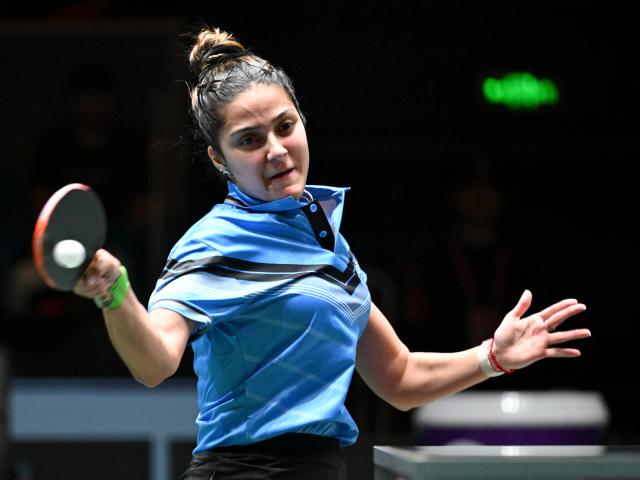 (251202) -- CHENGDU, Dec. 2, 2025 (Xinhua) -- Daniela Ortega of Chile competes in the women's singles match against Wang Manyu of China during the stage 1 group match between China and Chile at the ITTF Mixed Team World Cup 2025 in Chengdu, southwest China's Sichuan Province, Dec. 2, 2025. (Xinhua/Xu Bingjie)