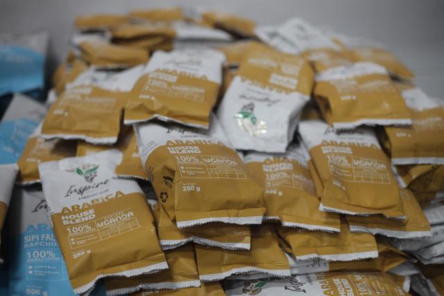 (251202) -- NTUNGAMO, Dec. 2, 2025 (Xinhua) -- This photo taken on Nov. 29, 2025 shows coffee packages at the African Coffee Park in western Uganda district of Ntungamo. TO GO WITH "China's zero-tariff policy opens new doors for Ugandan coffee exports: entrepreneur " (Photo by Ronald Ssekandi/Xinhua)