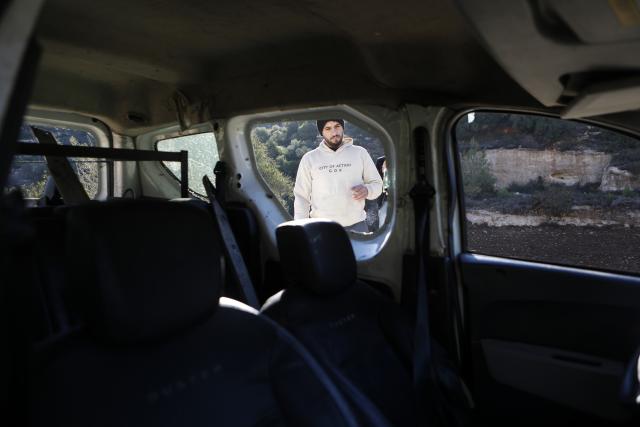 (251202) -- HEBRON, Dec. 2, 2025 (Xinhua) -- A Palestinian inspects the car of Muhannad Tariq Mohammad Al-Zgheer who was killed by the Israeli forces, in the West Bank city of Hebron, Dec. 2, 2025. The Palestinian Health Ministry said 17-year-old Muhannad Tariq Mohammad Al-Zgheer was shot dead in Hebron and that Israeli forces kept his body. Palestinian security officials said the shooting occurred as Israeli troops shut down northern checkpoints during a manhunt after an Israeli soldier was run over at a nearby military checkpoint. (Photo by Mamoun Wazwaz/Xinhua)