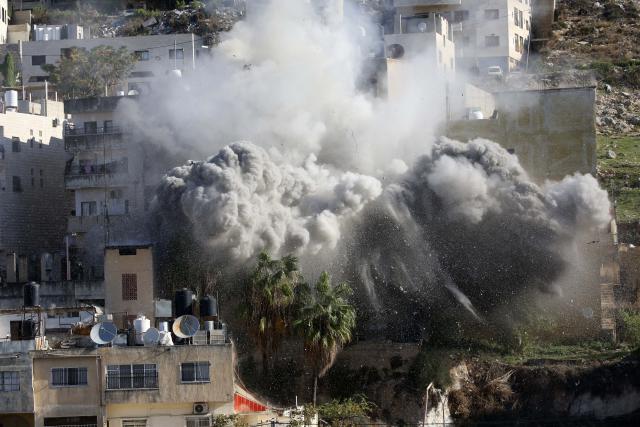 (251202) -- NABLUS, Dec. 2, 2025 (Xinhua) -- Smoke rises as Israeli forces blow up a Palestinian house in the West Bank city of Nablus, Dec. 2, 2025. (Photo by Nidal Eshtayeh/Xinhua)