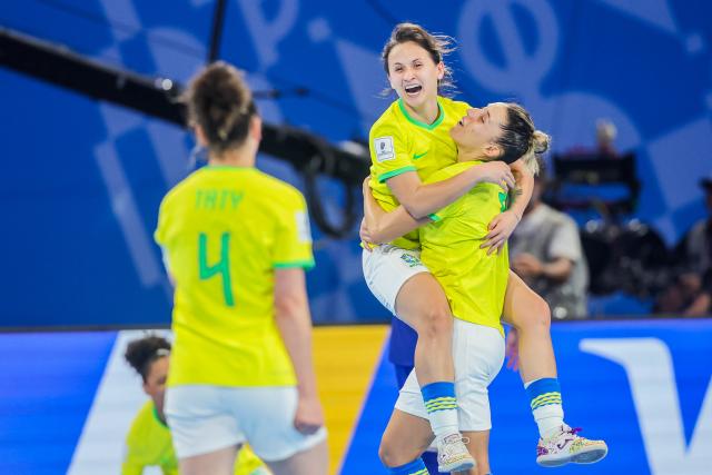 (251203) -- PASIG CITY, Dec. 3, 2025 (Xinhua) -- Players of Brazil celebrate a goal during the quarterfinal match between Brazil and Japan at the FIFA Futsal Women's World Cup 2025 in Pasig City, the Philippines, on Dec. 2, 2025. (Xinhua/Rouelle Umali)