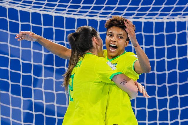 (251203) -- PASIG CITY, Dec. 3, 2025 (Xinhua) -- Luana Rodrigues (R) of Brazil celebrates after scoring during the quarterfinal match between Brazil and Japan at the FIFA Futsal Women's World Cup 2025 in Pasig City, the Philippines, on Dec. 2, 2025. (Xinhua/Rouelle Umali)