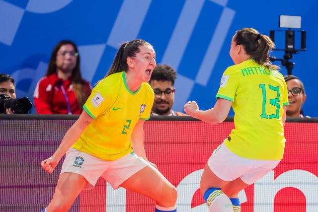 (251203) -- PASIG CITY, Dec. 3, 2025 (Xinhua) -- Players of Brazil celebrate a goal during the quarterfinal match between Brazil and Japan at the FIFA Futsal Women's World Cup 2025 in Pasig City, the Philippines, on Dec. 2, 2025. (Xinhua/Rouelle Umali)