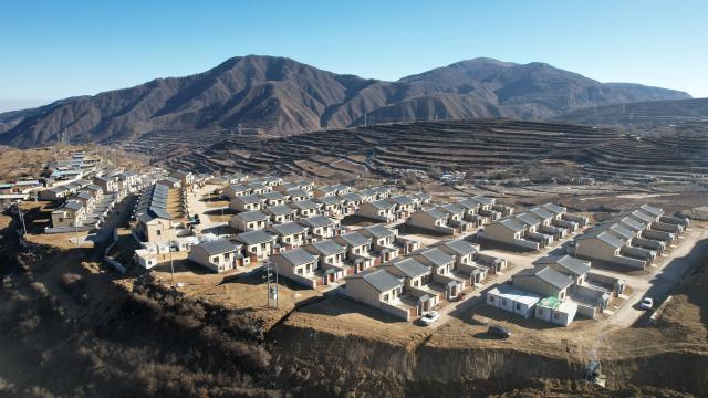 (251203) -- BEIJING, Dec. 3, 2025 (Xinhua) -- An aerial drone photo taken on Dec. 1, 2025 shows a resettlement site for flood-affected households in Jiuzhuanggou Village of Mapo Town in Yuzhong County, northwest China's Gansu Province. Yuzhong County, which is under the jurisdiction of the provincial capital Lanzhou, was hit by mountain torrents triggered by torrential rains this August. According to a reconstruction plan made by the local government, six resettlement sites for 325 families are on construction smoothly. 
   Currently, the supporting facilities as well as indoor and outdoor decorations at these resettlement sites are almost finished, waiting for check upon delivery. Disaster-affected people are moving into new homes in batches. (Xinhua/Chen Bin)