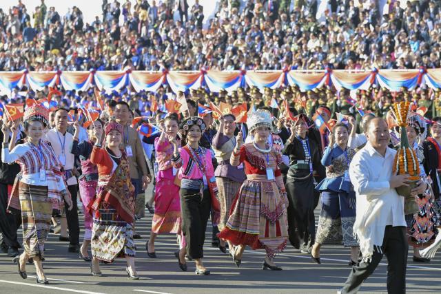 (251203) -- BEIJING, Dec. 3, 2025 (Xinhua) -- This photo taken on Dec. 2, 2025 shows a scene during an event in Vientiane to celebrate the 50th anniversary of the founding of the Lao People's Democratic Republic. A grand mass march and a military parade were held in Vientiane on Tuesday. (Xinhua/Gao Jie)