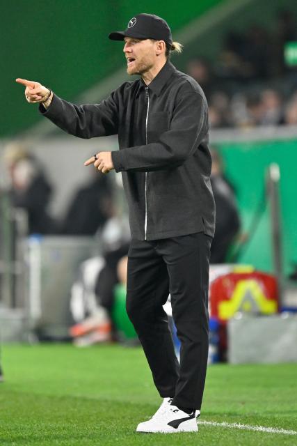 (251203) -- MOENCHENGLADBACH, Dec. 3, 2025 (Xinhua) -- Eugen Polanski, head coach of Borussia Moenchengladbach, reacts during the German Cup football round of 16 match between Borussia Moenchengladbach and FC St. Pauli in Moenchengladbach, Germany, Dec. 2, 2025. (Photo by Ulrich Hufnagel/Xinhua)