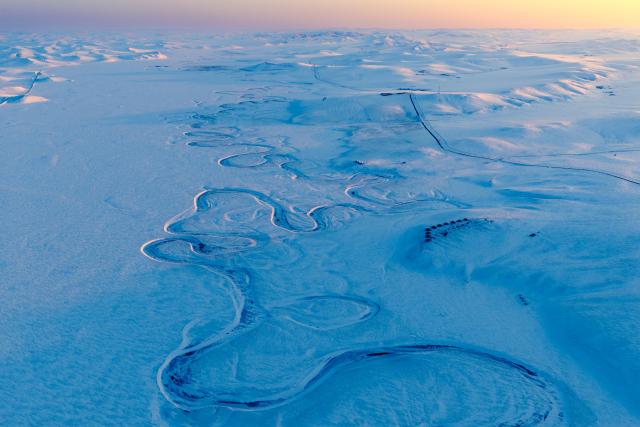 (251203) -- HULUN BUIR, Dec. 3, 2025 (Xinhua) -- An aerial drone photo taken on Dec. 3, 2025 shows Morigele River on the snow-covered Chenbarhu Banner Grassland in Hulun Buir, north China's Inner Mongolia Autonomous Region. (Xinhua/Darhan)