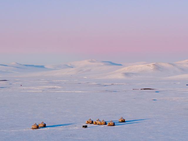 (251203) -- HULUN BUIR, Dec. 3, 2025 (Xinhua) -- This photo taken on Dec. 3, 2025 shows yurts on the snow-covered Chenbarhu Banner Grassland in Hulun Buir, north China's Inner Mongolia Autonomous Region. (Xinhua/Ma Jinrui)