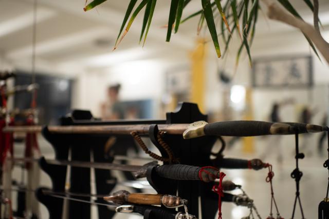 (251203) -- BERLIN, Dec. 3, 2025 (Xinhua) -- Tai Chi Swords are seen at XUAN-Gong Fu Academy in Berlin, Germany, Nov. 13, 2025. Ismet Himmet, with his Chinese name You Lihan, speaks fluent Chinese and has devoted more than thirty years to Chinese martial arts. Himmet, now 48, began learning kung fu in 1991. Nine years later, he traveled to China for the first time. From 2006 he started teaching Chinese martial arts full-time in Germany. At XUAN-Gong Fu Academy, a kung fu school that Himmet established in Berlin, students of all ages practise Tai Chi, Ba Gua Zhang, Xingyiquan and other kung fu styles every day. In his view, martial arts are not just a sport, but also a way of living and something that helps the mind turn toward the positive.
  Thousands of kilometers away, in east China's Shanghai, She Yuran, known as "A Xiao", is engaged in a similar career as Himmet. Born in Sichuan of China, She Yuran studied Historical European Martial Arts (HEMA) at college. His interest in HEMA grew into a deep study of historical weapons and combat methods.
  In 2015, She Yuran co-founded the Shanghai Historical Martial Arts (SHMA) club, offering systematic training in both European and Chinese martial arts. SHMA now has more than 200 members, over half of whom study German swordsmanship. 
  While Ismet Himmet helps Germans understand the philosophy and practice of Chinese martial arts, She Yuran brings European sword traditions to young Chinese practitioners. Their commitment shows how martial arts can carry culture across borders, allowing mutual understanding to grow through their fists and blades. (Xinhua/Zhang Haofu)