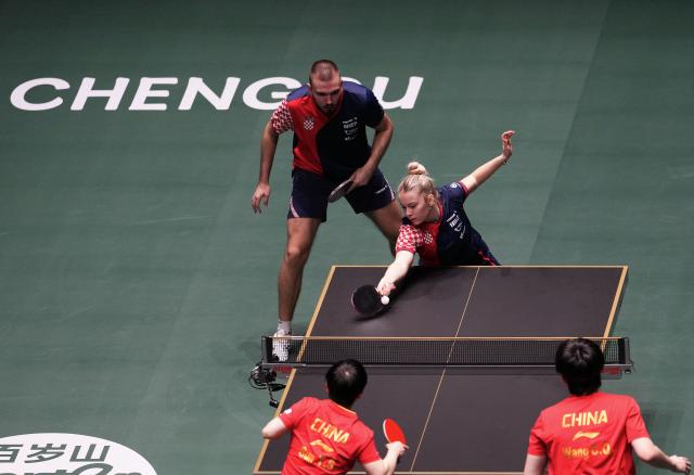 (251203) -- CHENGDU, Dec. 3, 2025 (Xinhua) -- Ivor Ban(top L)/Hana Arapovic(top R) of Croatia compete during the mixed doubles match against Wang Chuqin(bottom R)/Sun Yingsha of China during the stage 2 match between China and Croatia at the ITTF Mixed Team World Cup 2025 in Chengdu, southwest China's Sichuan Province, Dec. 3, 2025. (Xinhua/Wang Ying)