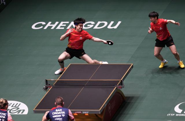 (251203) -- CHENGDU, Dec. 3, 2025 (Xinhua) -- Wang Chuqin(L)/Sun Yingsha of China compete during the mixed doubles match against Ivor Ban/Hana Arapovic of Croatia during the stage 2 match between China and Croatia at the ITTF Mixed Team World Cup 2025 in Chengdu, southwest China's Sichuan Province, Dec. 3, 2025. (Xinhua/Wang Ying)