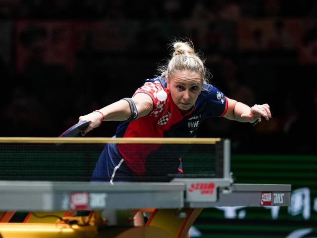 (251203) -- CHENGDU, Dec. 3, 2025 (Xinhua) -- Ivana Malobabic of Croatia hits a return during the women's singles match against Kuai Man of China during the stage 2 match between China and Croatia at the ITTF Mixed Team World Cup 2025 in Chengdu, southwest China's Sichuan Province, Dec. 3, 2025. (Xinhua/Wang Xi)