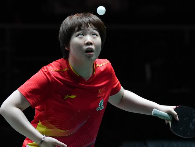 (251203) -- CHENGDU, Dec. 3, 2025 (Xinhua) -- Kuai Man of China serves during the women's singles match against Ivana Malobabic of Croatia during the stage 2 match between China and Croatia at the ITTF Mixed Team World Cup 2025 in Chengdu, southwest China's Sichuan Province, Dec. 3, 2025. (Xinhua/Wang Xi)