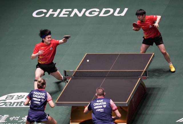 (251203) -- CHENGDU, Dec. 3, 2025 (Xinhua) -- Wang Chuqin(top L)/Sun Yingsha(top R) of China compete during the mixed doubles match against Ivor Ban/Hana Arapovic of Croatia during the stage 2 match between China and Croatia at the ITTF Mixed Team World Cup 2025 in Chengdu, southwest China's Sichuan Province, Dec. 3, 2025. (Xinhua/Wang Ying)