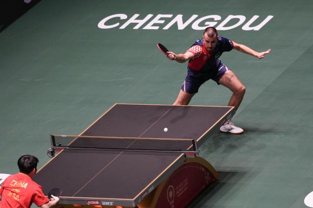 (251203) -- CHENGDU, Dec. 3, 2025 (Xinhua) -- Tomislav Pucar of Croatia hits a return during the men's singles match against Lin Shidong of China during the stage 2 match between China and Croatia at the ITTF Mixed Team World Cup 2025 in Chengdu, southwest China's Sichuan Province, Dec. 3, 2025. (Xinhua/Wang Ying)