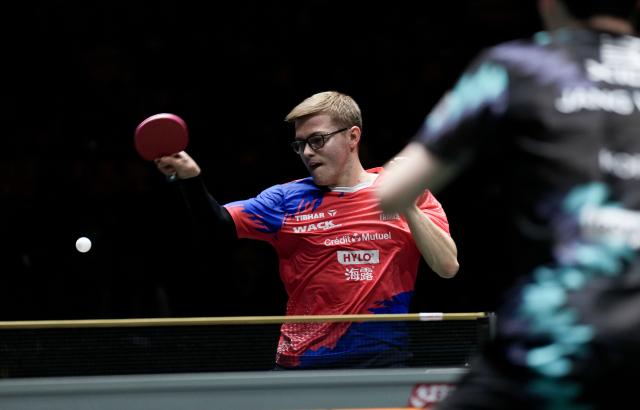 (251203) -- CHENGDU, Dec. 3, 2025 (Xinhua) -- Alexis Lebrun of France competes in the men's singles match against Jang Woojin of South Korea during the stage 2 group match between South Korea and France at the ITTF Mixed Team World Cup 2025 in Chengdu, southwest China's Sichuan Province, Dec. 3, 2025. (Xinhua/Wang Ying)