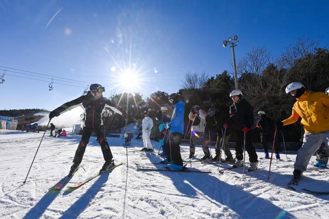 (251203) -- TIANJIN, Dec. 3, 2025 (Xinhua) -- People practice skiing at a ski resort in Jizhou District, north China's Tianjin, Dec. 2, 2025. In recent years, authorities in Jizhou District of Tianjin, which sits on the east section of the Yanshan Mountain, have been boosting ice and snow tourism by exploring local resources and improving service infrastructure. (Xinhua/Zhao Zishuo)