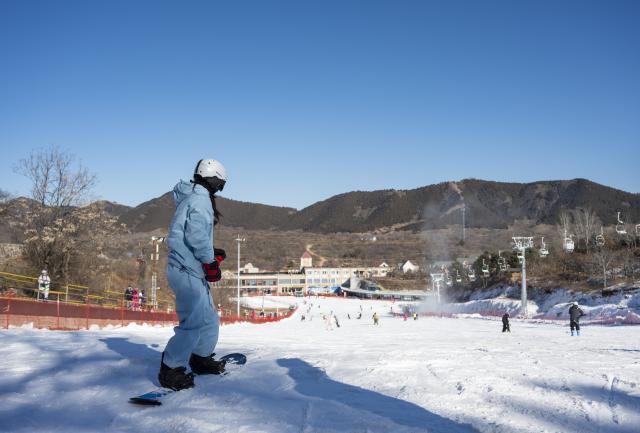 (251203) -- TIANJIN, Dec. 3, 2025 (Xinhua) -- People ski at a ski resort in Jizhou District, north China's Tianjin, Dec. 2, 2025. In recent years, authorities in Jizhou District of Tianjin, which sits on the east section of the Yanshan Mountain, have been boosting ice and snow tourism by exploring local resources and improving service infrastructure. (Xinhua/Fu Tian)