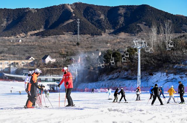 (251203) -- TIANJIN, Dec. 3, 2025 (Xinhua) -- People practice skiing at a ski resort in Jizhou District, north China's Tianjin, Dec. 2, 2025. In recent years, authorities in Jizhou District of Tianjin, which sits on the east section of the Yanshan Mountain, have been boosting ice and snow tourism by exploring local resources and improving service infrastructure. (Xinhua/Zhao Zishuo)