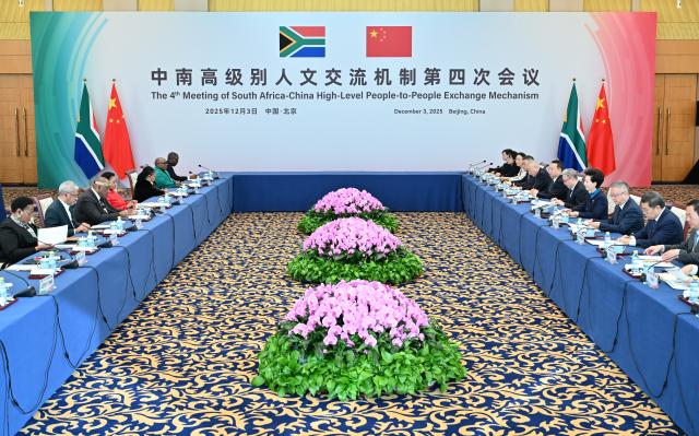 (251203) -- BEIJING, Dec. 3, 2025 (Xinhua) -- Shen Yiqin, Chinese State Councilor and the Chinese chairperson of the China-South Africa high-level people-to-people exchange mechanism, co-hosts the 4th meeting of the mechanism with Gayton McKenzie, South Africa's Minister of Sports, Arts and Culture, who is also the South African chairperson of the mechanism, in Beijing, capital of China, Dec. 3, 2025. (Xinhua/Dai Tianfang)