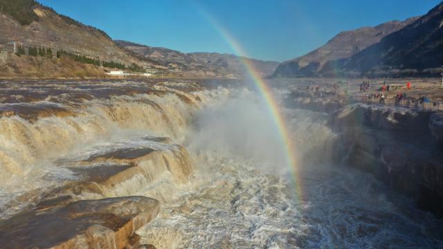 (251203) -- JIXIAN, Dec. 3, 2025 (Xinhua) -- A drone photo taken on Dec. 3, 2025 shows a double rainbow over the Hukou Waterfall in Jixian County, north China's Shanxi Province. (Photo by Lyu Guiming/Xinhua)