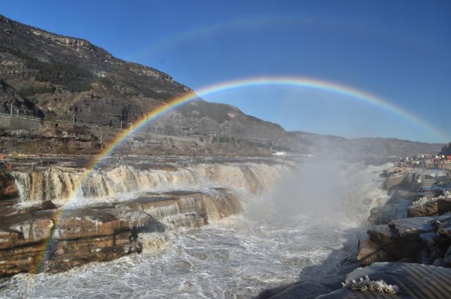 (251203) -- JIXIAN, Dec. 3, 2025 (Xinhua) -- A double rainbow appears in the sky over the Hukou Waterfall in Jixian County, north China's Shanxi Province, Dec. 3, 2025. (Photo by Lyu Guiming/Xinhua)