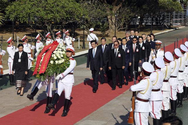(251203) -- VIENTIANE, Dec. 3, 2025 (Xinhua) -- Wang Huning, a member of the Standing Committee of the Political Bureau of the Communist Party of China (CPC) Central Committee and chairman of the National Committee of the Chinese People's Political Consultative Conference (CPPCC), lays a wreath at the Tomb of the Unknown Soldiers in Vientiane, Laos, Dec. 2, 2025. Wang led a Chinese party and government delegation on an official visit to Laos from Dec. 1 to 3, and attended celebrations marking the 50th anniversary of the founding of the Lao People's Democratic Republic.
Wang and his delegation arrived here at the invitation of the Lao People's Revolutionary Party (LPRP) Central Committee and the Lao government. (Xinhua/Yao Dawei)
