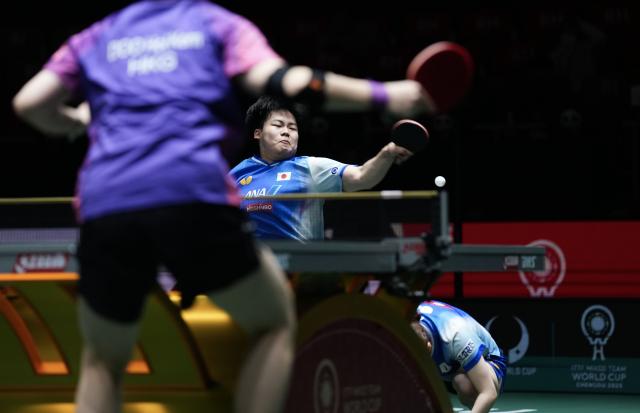 (251203) -- CHENGDU, Dec. 3, 2025 (Xinhua) -- Matsushima Sora (L) /Odo Satsuki of Japan compete in the mixed doubles match against Wong Chun Ting/Doo Hoi Kem of China's Hong Kong during the stage 2 group match between Japan and China's Hong Kong at the ITTF Mixed Team World Cup 2025 in Chengdu, southwest China's Sichuan Province, Dec. 3, 2025. (Xinhua/Wang Ying)