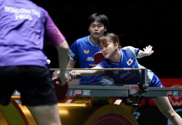 (251203) -- CHENGDU, Dec. 3, 2025 (Xinhua) -- Matsushima Sora/Odo Satsuki (R) of Japan compete in the mixed doubles match against Wong Chun Ting/Doo Hoi Kem of China's Hong Kong during the stage 2 group match between Japan and China's Hong Kong at the ITTF Mixed Team World Cup 2025 in Chengdu, southwest China's Sichuan Province, Dec. 3, 2025. (Xinhua/Wang Ying)
