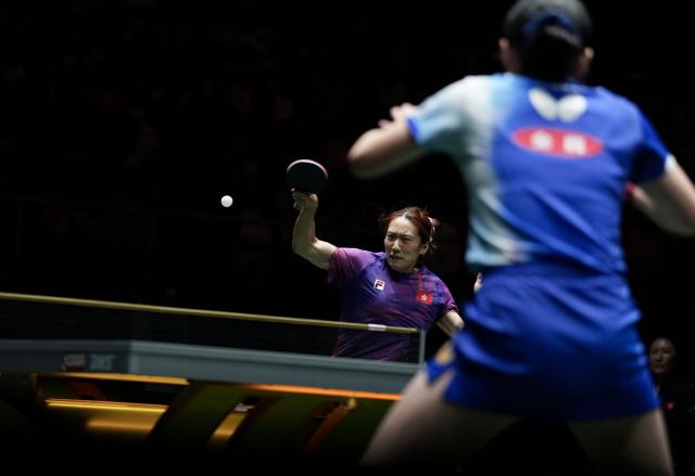 (251203) -- CHENGDU, Dec. 3, 2025 (Xinhua) -- Zhu Chengzhu of China's Hong Kong hits a return in the women's singles match against Harimoto Miwa of Japan during the stage 2 group match between Japan and China's Hong Kong at the ITTF Mixed Team World Cup 2025 in Chengdu, southwest China's Sichuan Province, Dec. 3, 2025. (Xinhua/Wang Ying)