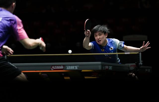 (251203) -- CHENGDU, Dec. 3, 2025 (Xinhua) -- Harimoto Tomokazu of Japan hits a return in the men's singles match against Lam Siu Hang of China's Hong Kong during the stage 2 group match between Japan and China's Hong Kong at the ITTF Mixed Team World Cup 2025 in Chengdu, southwest China's Sichuan Province, Dec. 3, 2025. (Xinhua/Wang Ying)