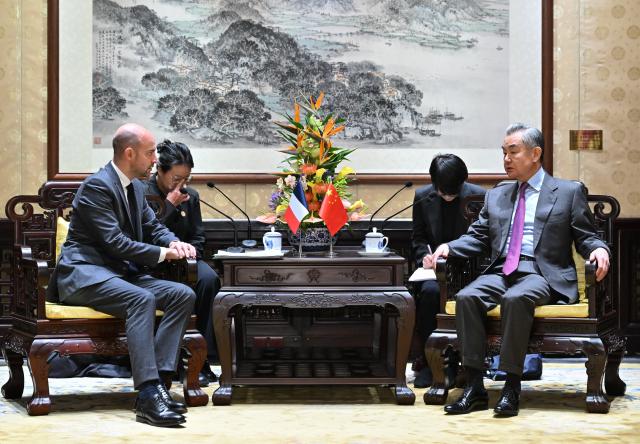 (251203) -- BEIJING, Dec. 3, 2025 (Xinhua) -- Chinese Foreign Minister Wang Yi, also a member of the Political Bureau of the Communist Party of China Central Committee, meets with French Foreign Minister Jean-Noel Barrot in Beijing, capital of China, Dec. 3, 2025. (Xinhua/Dai Tianfang)