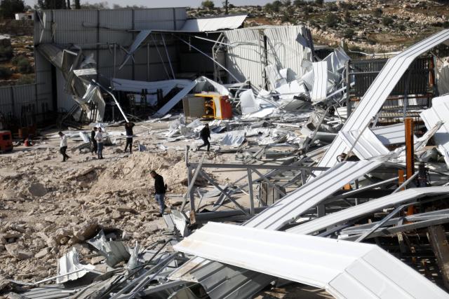 (251203) -- HEBRON, Dec. 3, 2025 (Xinhua) -- Palestinians inspect a destroyed facility in Beit Oula town northwest of Hebron in the West Bank, on Dec. 3, 2025. (Photo by Mamoun Wazwaz/Xinhua)