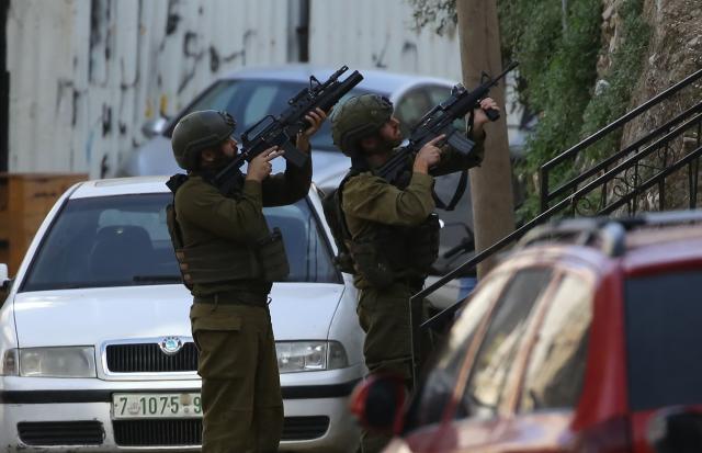(251203) -- NABLUS, Dec. 3, 2025 (Xinhua) -- Israeli soldiers participate in a military operation in the West Bank city of Nablus on Dec. 3, 2025. Israeli forces stormed several neighborhoods at dawn in a new raid. (Photo by Nidal Eshtayeh/Xinhua)
