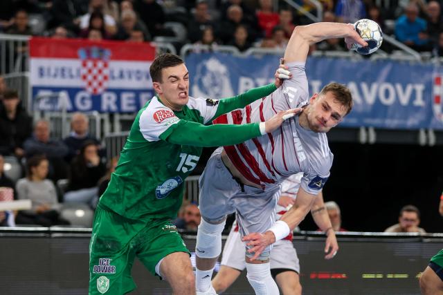 (251204) -- ZAGREB, Dec. 4, 2025 (Xinhua) -- Ihar Bialiauski (R) of HC Zagreb shoots the ball during the EHF Champions League group B match between HC Zagreb and HC Eurofarm Pelister in Zagreb, Croatia, on Dec. 3, 2025. (Photo by Igor Kralj/PIXSELL via Xinhua)