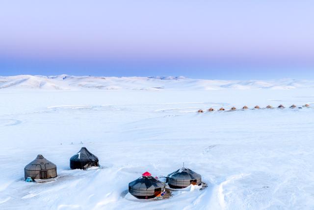 (251204) -- BEIJING, Dec. 4, 2025 (Xinhua) -- An aerial drone photo taken on Dec. 3, 2025 shows yurts on the snow-covered Chenbarhu Banner Grassland in Hulun Buir, north China's Inner Mongolia Autonomous Region. (Xinhua/Ma Jinrui)