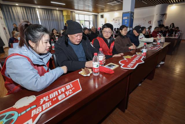 (251204) -- JIAXING, Dec. 4, 2025 (Xinhua) -- Visually-impaired audience accompanied by volunteers watch the movie "One and Only" at a cinema in Jiaxing, east China's Zhejiang Province, Dec. 3, 2025. Wednesday marks the 34th International Day of Persons with Disabilities. Visually-impaired people enjoyed a barrier-free version of the movie "One and Only" here in Nanhu District of Jiaxing. The activity was under the Cinema of Light, a volunteer project initiated by faculty and students of the Communication University of China (CUC) in 2017 to produce films with voice descriptions of the visual content. (Xinhua/Xu Yu)