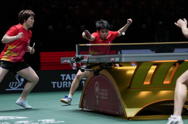 (251204) -- CHENGDU, Dec. 4, 2025 (Xinhua) -- Lin Shidong(R)/Kuai Man of China compete during the mixed doubles match against Park Ganghyeon/Kim Nayeong of South Korea during the stage 2 group match between China and South Korea at the ITTF Mixed Team World Cup 2025 in Chengdu, southwest China's Sichuan Province, Dec. 4, 2025. (Xinhua/Wang Ying)