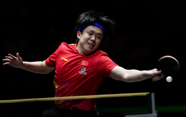 (251204) -- CHENGDU, Dec. 4, 2025 (Xinhua) -- Wang Chuqin of China hits a return during the men's singles match against An Jaehyun of South Korea during the stage 2 group match between China and South Korea at the ITTF Mixed Team World Cup 2025 in Chengdu, southwest China's Sichuan Province, Dec. 4, 2025. (Xinhua/Wang Ying)