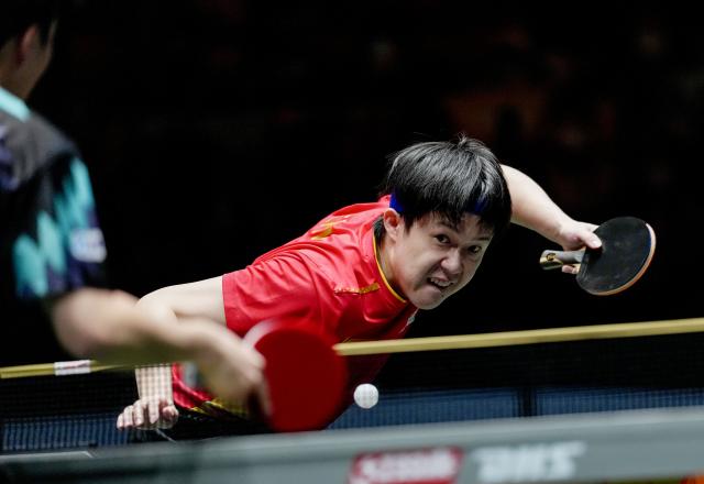 (251204) -- CHENGDU, Dec. 4, 2025 (Xinhua) -- Wang Chuqin of China serves during the men's singles match against An Jaehyun of South Korea during the stage 2 group match between China and South Korea at the ITTF Mixed Team World Cup 2025 in Chengdu, southwest China's Sichuan Province, Dec. 4, 2025. (Xinhua/Wang Ying)