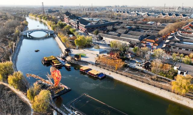 (251204) -- TIANJIN, Dec. 4, 2025 (Xinhua) -- An aerial drone photo taken on Dec. 3, 2025 shows a scenery of Yangliuqing ancient town in Tianjin, north China, on Dec. 3, 2025. Sitting on the outskirts of the port city of Tianjin, Yangliuqing ancient town is a tourist town that is well-known for its woodblock new year pictures. It is run through by the Grand Canal, the world's longest man-made waterway. (Xinhua/Zhao Zishuo)
