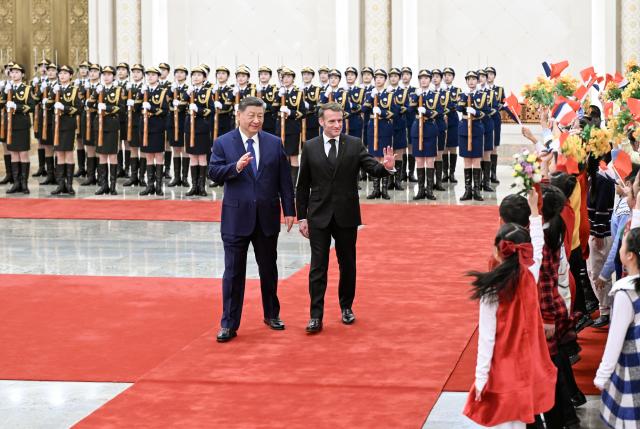 (251204) -- BEIJING, Dec. 4, 2025 (Xinhua) -- Chinese President Xi Jinping holds a welcome ceremony for French President Emmanuel Macron at the Northern Hall of the Great Hall of the People prior to their talks in Beijing, capital of China, Dec. 4, 2025. Xi held talks with Macron, who is on a state visit to China, in Beijing on Thursday. (Xinhua/Xie Huanchi)