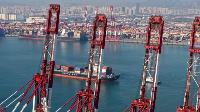 (251204) -- QINGDAO, Dec. 4, 2025 (Xinhua) -- A drone photo taken on Dec. 4, 2025 shows a ship entering the Qianwan Container Terminal of Qingdao Port in east China's Shandong Province. With nearly 240 foreign trade routes, Qingdao Port connects over 700 ports in more than 180 countries and regions worldwide. (Xinhua/Li Ziheng)