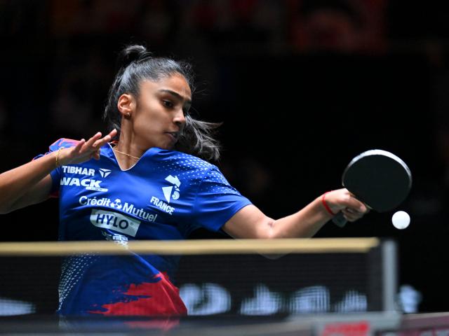 (251204) -- CHENGDU, Dec. 4, 2025 (Xinhua) -- Prithika Pavade of France competes in the women's singles match against Wang Manyu of China during the stage 2 group match between China and France at the ITTF  Mixed Team World Cup 2025 in Chengdu, southwest China's Sichuan Province, Dec. 4, 2025. (Xinhua/Xu Bingjie)
