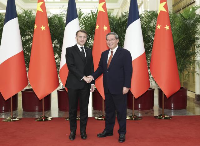 (251204) -- BEIJING, Dec. 4, 2025 (Xinhua) -- Chinese Premier Li Qiang meets with French President Emmanuel Macron, who is on a state visit to China, at the Great Hall of the People in Beijing, capital of China, Dec. 4, 2025. (Xinhua/Huang Jingwen)