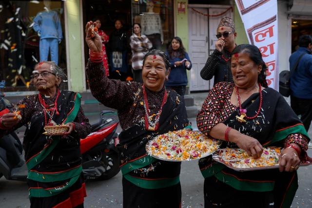 (251204) -- KATHMANDU, Dec. 4, 2025 (Xinhua) -- People in traditional attire take part in a rally celebrating Yomari Punhi in Kathmandu, Nepal, on Dec. 4, 2025. Yomari Punhi is a festival especially celebrated by Newar community in Nepal to mark the end of the rice harvest on full moon day. (Photo by Sulav Shrestha/Xinhua)