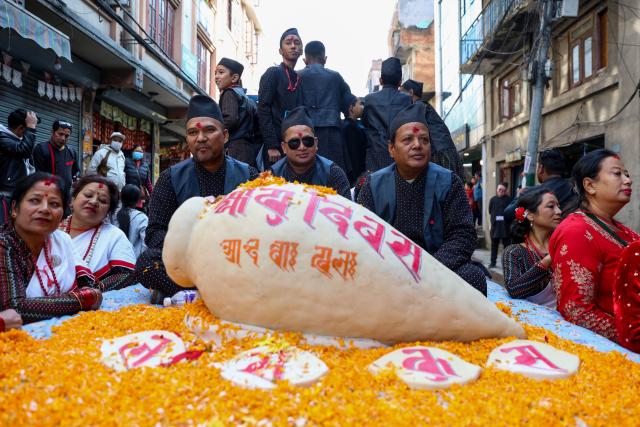 (251204) -- KATHMANDU, Dec. 4, 2025 (Xinhua) -- Yomari, a Newari sweet delicacy made up of rice flour and other ingredients, is on display during a rally celebrating Yomari Punhi in Kathmandu, Nepal, on Dec. 4, 2025. Yomari Punhi is a festival especially celebrated by Newar community in Nepal to mark the end of the rice harvest on full moon day. (Photo by Sulav Shrestha/Xinhua)