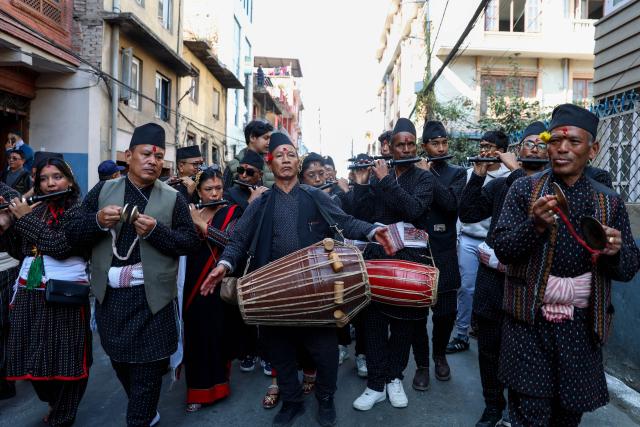 (251204) -- KATHMANDU, Dec. 4, 2025 (Xinhua) -- People in traditional attire perform during a rally celebrating Yomari Punhi in Kathmandu, Nepal, on Dec. 4, 2025. Yomari Punhi is a festival especially celebrated by Newar community in Nepal to mark the end of the rice harvest on full moon day. (Photo by Sulav Shrestha/Xinhua)