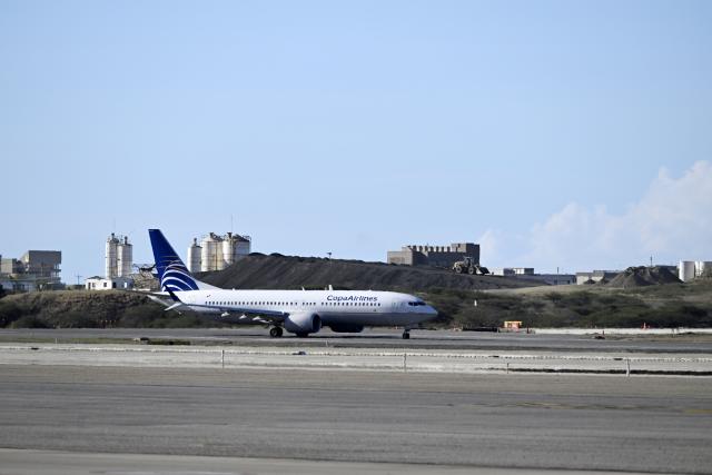 (251204) -- CARACAS, Dec. 4, 2025 (Xinhua) -- A Copa Airlines airplane taxis at Simon Bolivar International Airport in Maiquetia, Venezuela, Dec. 3, 2025. Panamanian carrier Copa Airlines has suspended Thursday and Friday flights to and from Venezuela's capital Caracas, citing a navigation signal issue reported by its pilots. (Xinhua/Li Muzi)