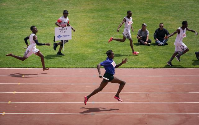 (251205) -- NAIROBI, Dec. 5, 2025 (Xinhua) -- Participants compete in the 4x100m relay race at the China-Kenya Friendship Games in Nairobi, Kenya, on Dec. 4, 2025. The inaugural China-Kenya Friendship Games took place on Thursday in Nairobi, the capital of Kenya, as part of efforts to strengthen bilateral ties.
The day-long competition saw over 700 Chinese and Kenyan attendants from 19 Chinese companies who are members of the Kenya-China Economic and Trade Association (KCETA), featuring track and field events, as well as fun games. (Xinhua/Han Xu)